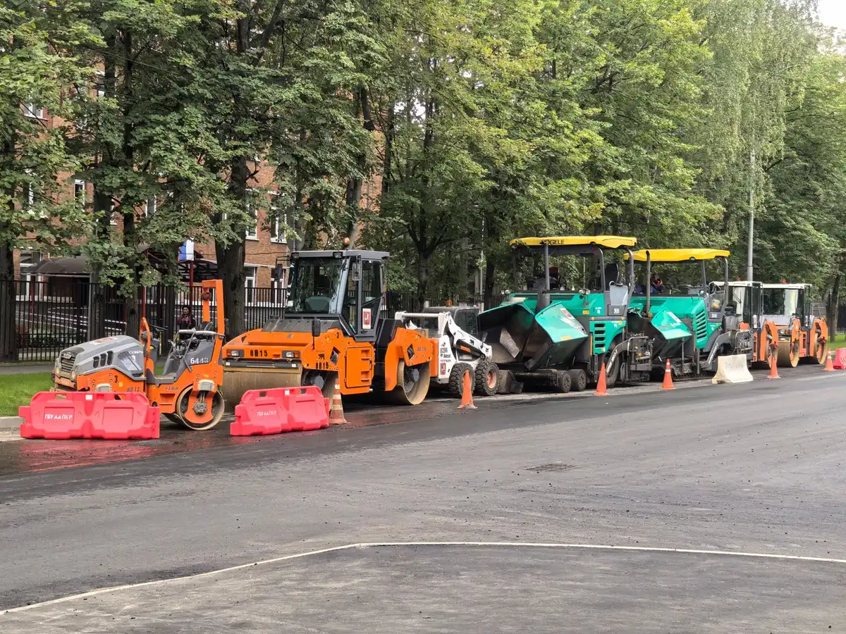 City maintenance crews in colorful work gear repainting playground equipment and basketball courts, tools in hand, surrounded by freshly mulched planting beds and restored benches under bright daylight