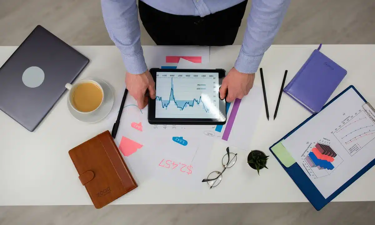A professional office environment with desk, computer, and papers representing business operations
