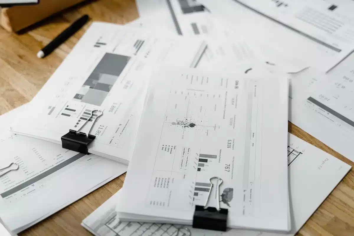 A sleek modern investment office overlooking a city skyline, with financial data streaming across multiple monitors displaying market indices and portfolio performance charts, representing institutional wealth management at scale.