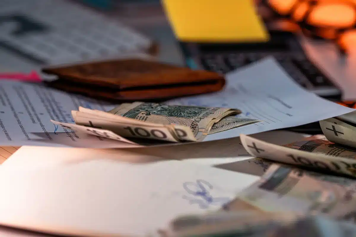 A mortgage paperwork document with calculator and pen on a desk