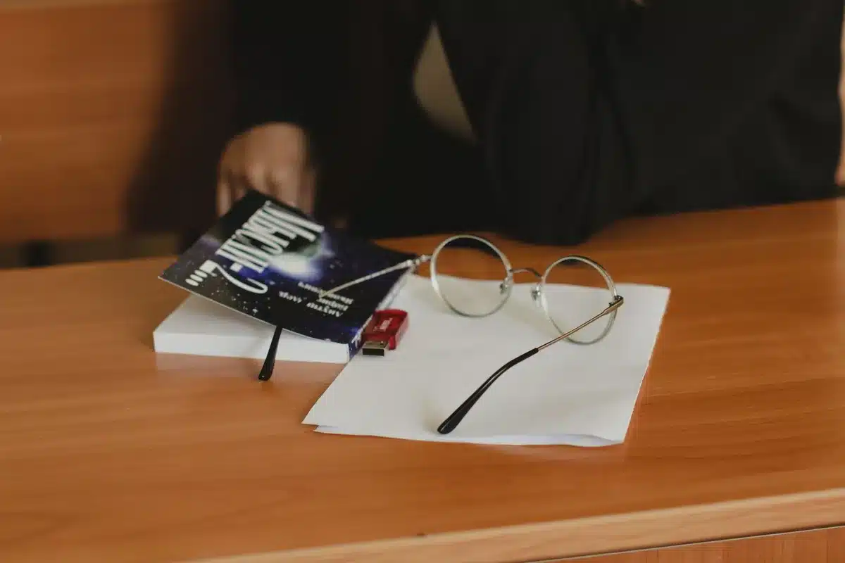 A White House office setting with papers and screens, showing the workspace of a high-level presidential aide, emphasizing information flow and gatekeeping