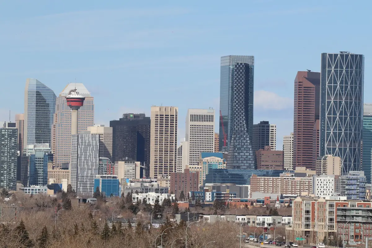 Downtown Minnesota city skyline with modern office buildings and clear sky, reflecting economic infrastructure and opportunity