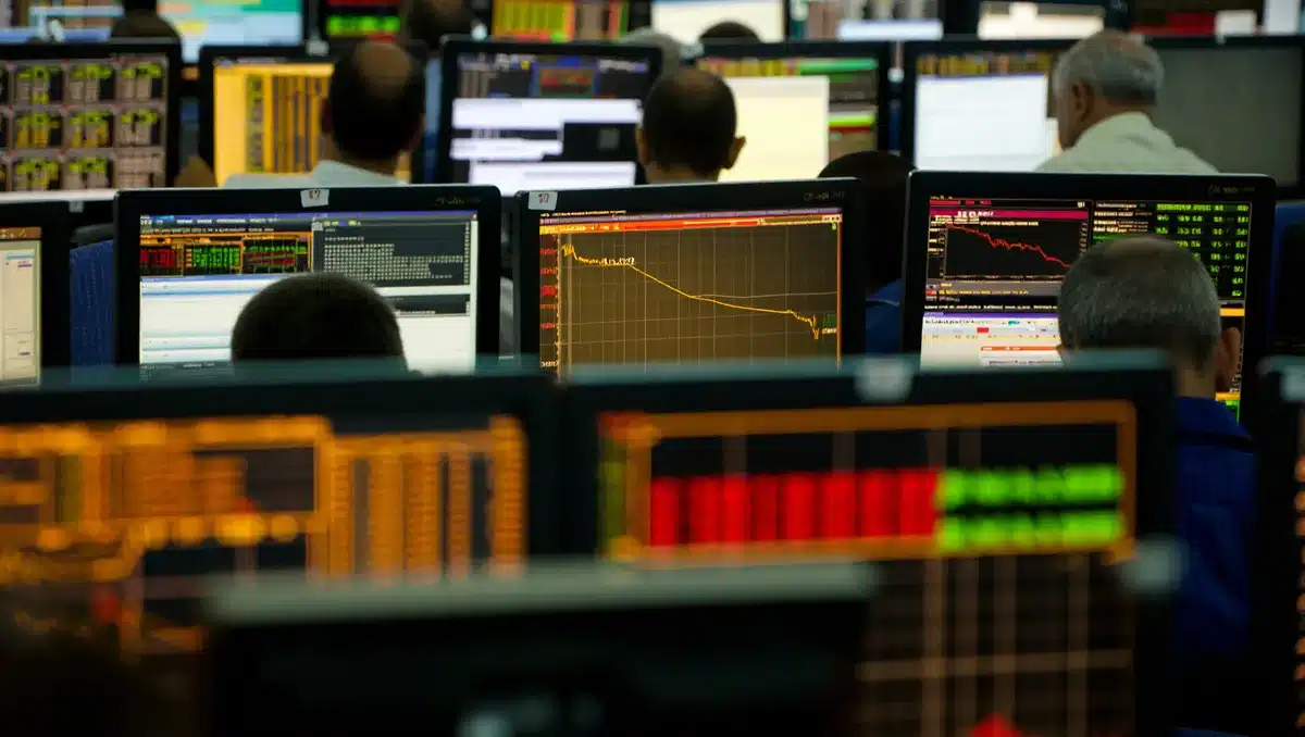 Stock market trading floor with glowing financial data displays and ascending price charts, traders focused on screens | stock market trading screens surge