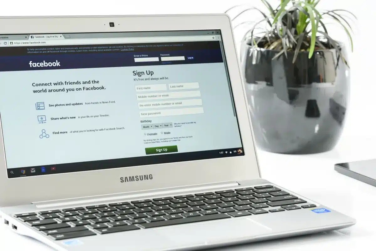 A computer screen displaying a shopping browser extension interface with affiliate tracking code visible in the background, a laptop keyboard in soft focus, digital commission notifications appearing on the monitor