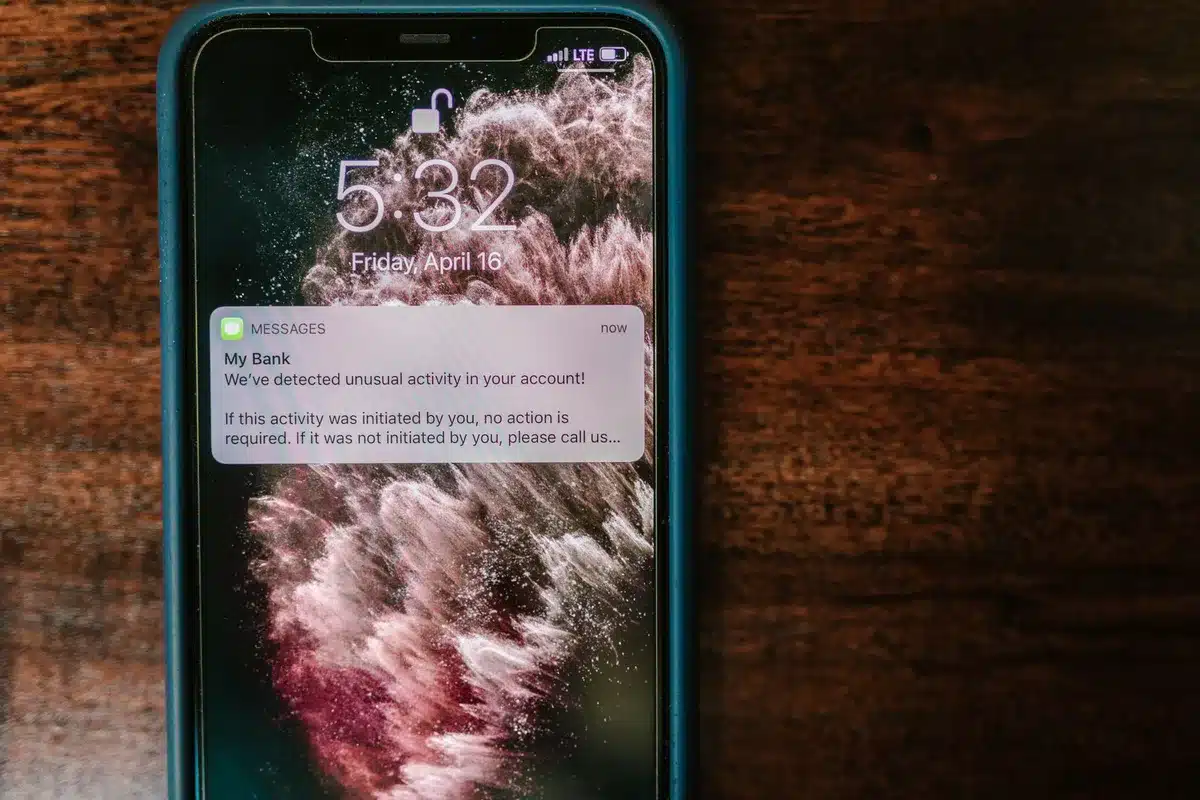 A smartphone displaying a shopping app interface with a notification badge warning of affiliate fraud, symbolizing consumer awareness of deceptive practices.
