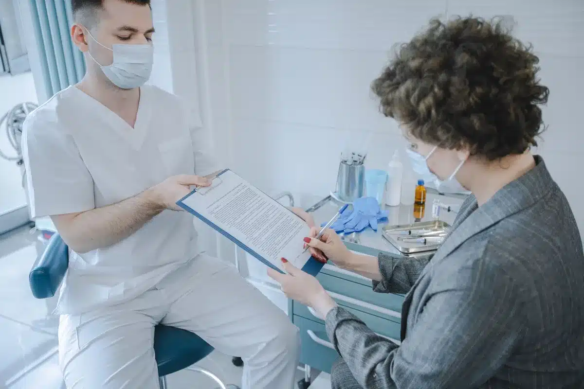 A regulatory compliance checklist or quality assurance document being reviewed at a desk, with FDA and pharmaceutical industry documentation visible, representing the intensified oversight and enforcement environment.