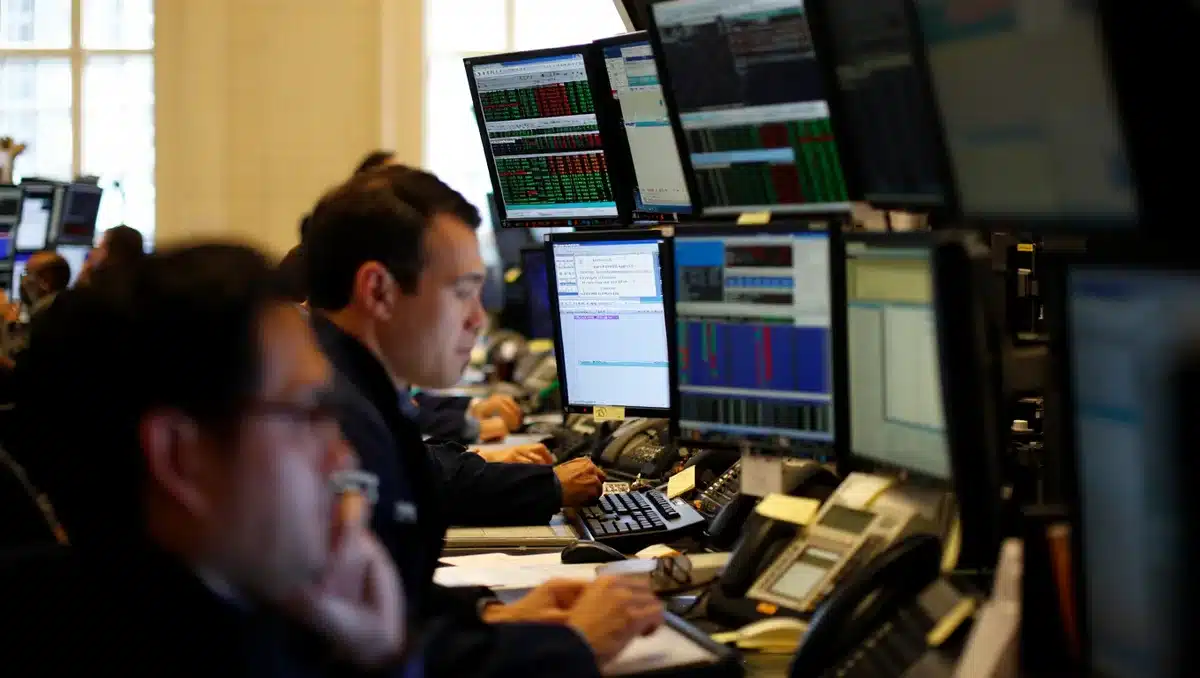 Space sector trading floor with multiple monitors displaying stock tickers and market data, early morning light streaming through office windows, traders monitoring premarket movements | stock market screens space stocks