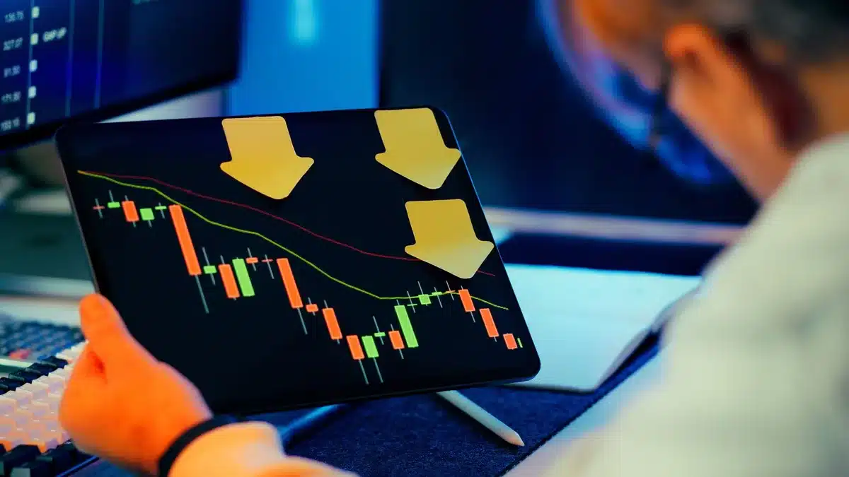A graph showing declining inflation trend line on a financial display screen