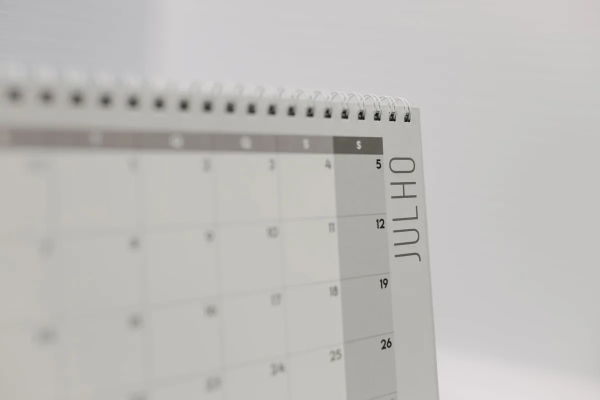 a calendar page showing August 2026 with payment dates highlighted in different colors, dollar sign symbols marking distribution days