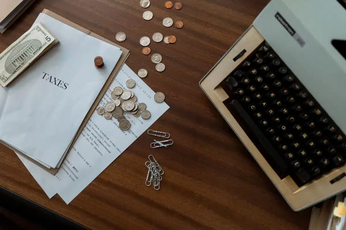 An elderly couple reviewing financial documents at a kitchen table, reading glasses resting on paperwork, morning sunlight streaming through a window, expressions of cautious optimism
