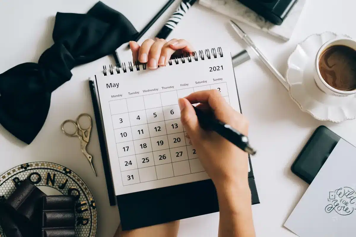 A calendar page showing October circled with notification symbols, representing the announcement date