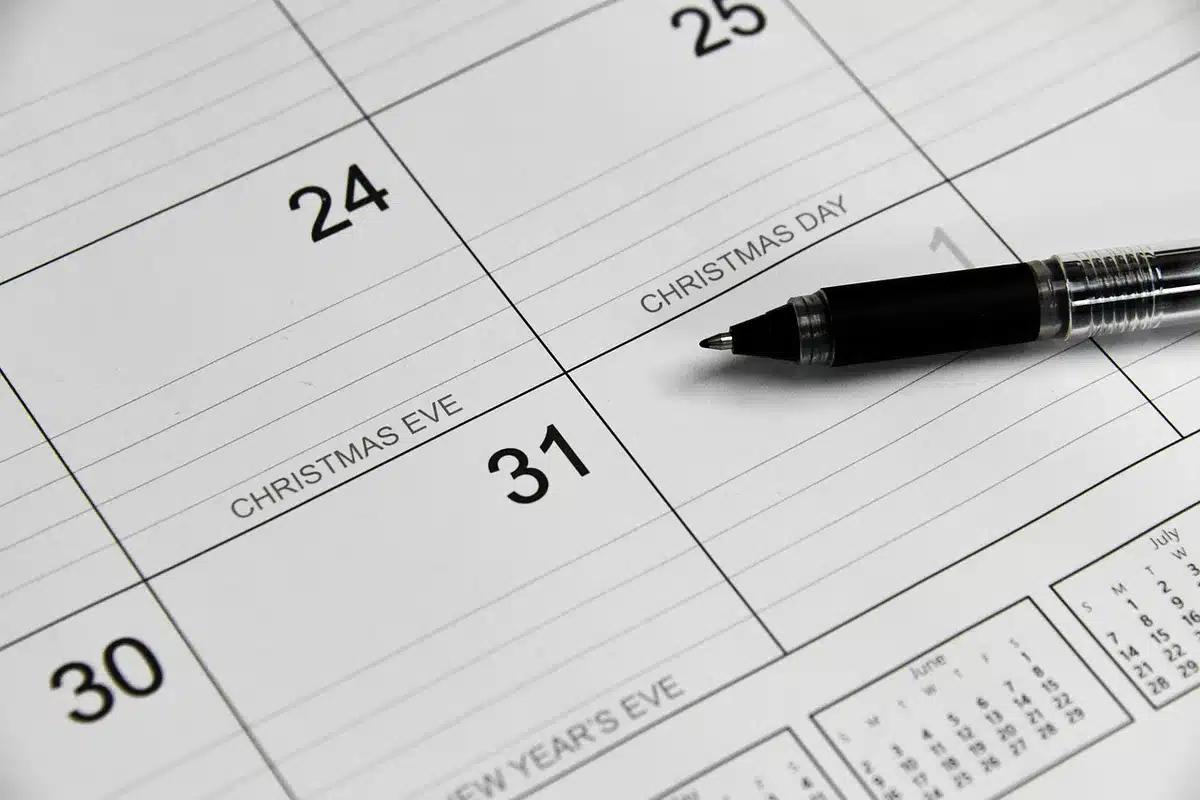 A calendar page showing September 2026 with payment dates highlighted on specific Wednesdays, a bank statement or check visible nearby, symbolizing scheduled financial transactions.