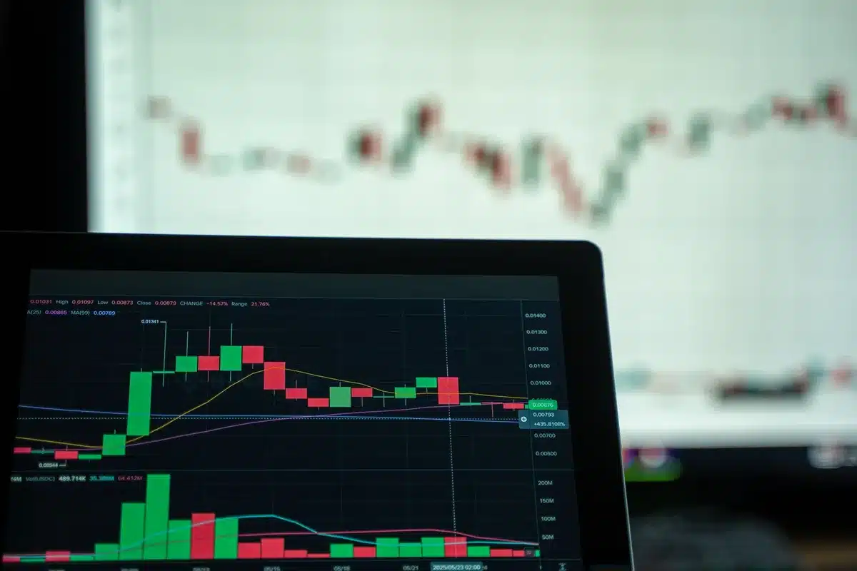 A stock market trading screen displaying real-time option chains and implied volatility metrics for technology sector earnings, with glowing candlestick charts and numerical data visible in cool blue tones.