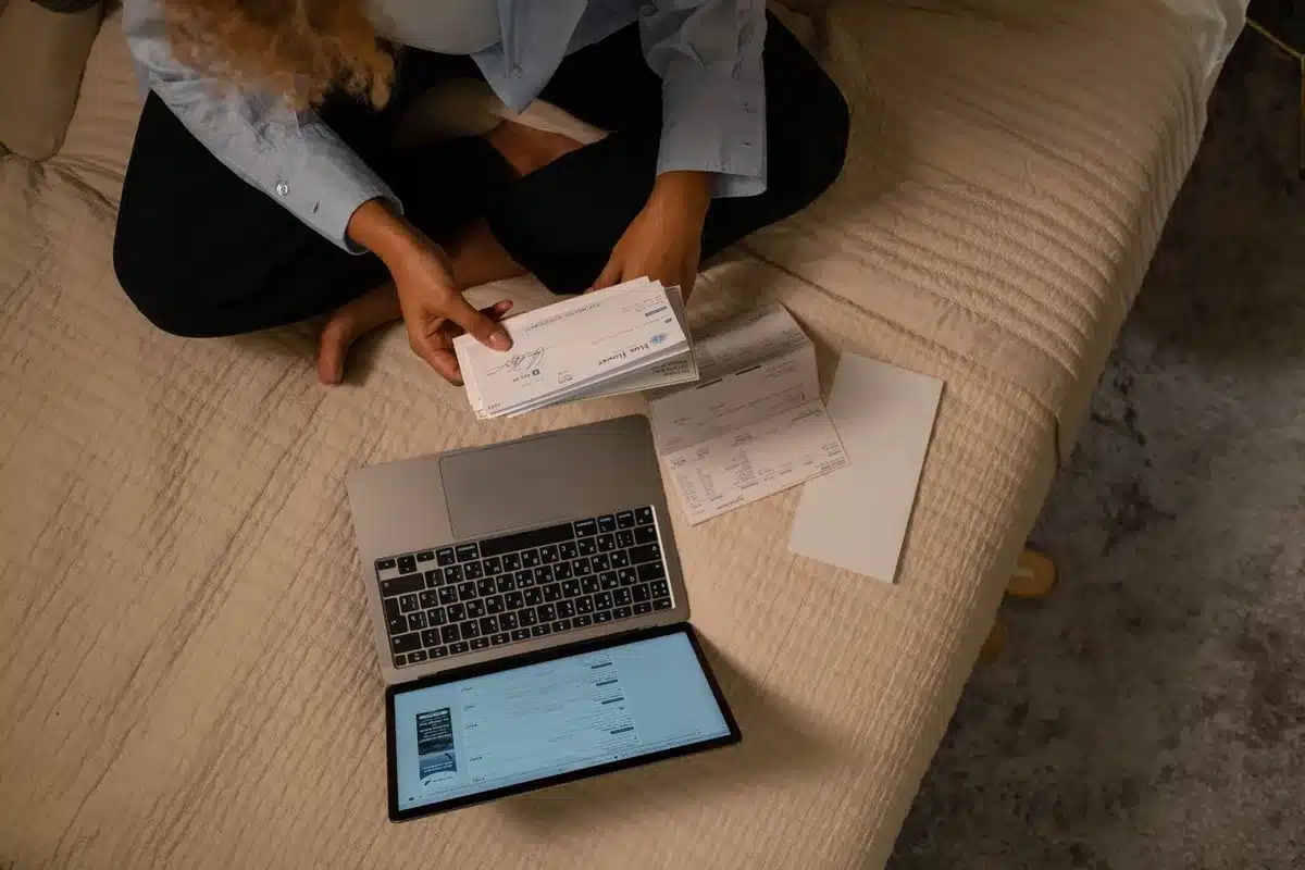 Envelope with check and dollar bills on a home table, soft natural light, customer joy