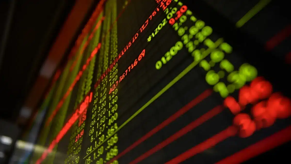 A digital stock ticker displaying market indices and price movements, numbers scrolling in real-time on a dark background, multiple colored lines trending upward and downward, data streams flowing continuously | stock market trading screen