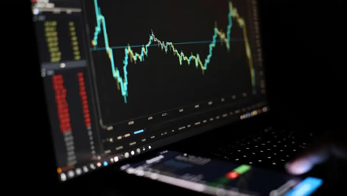 A glowing upward-trending stock chart on a dark screen, with candlestick patterns in neon green and blue, a smartphone displaying market data in the foreground | stock market gains chart