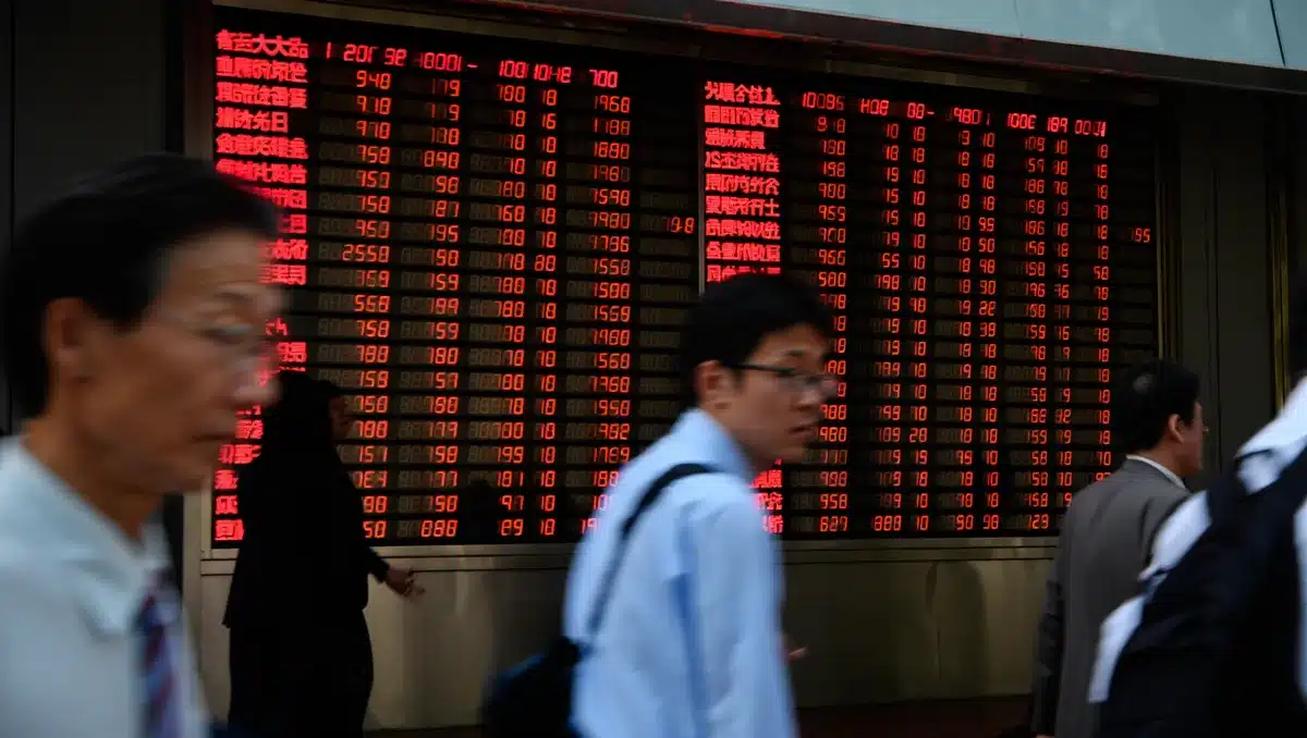 A digital stock ticker displaying red numbers, reflecting market decline amid geopolitical tension | stock market decline board