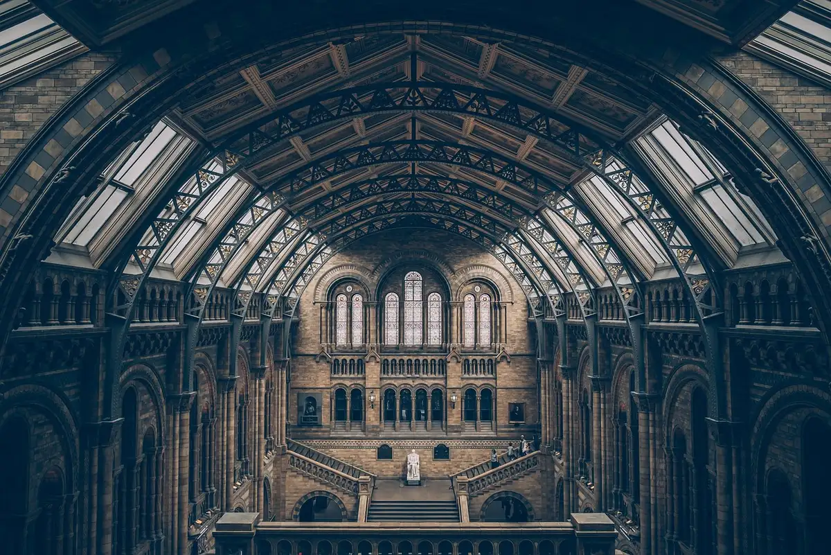 Marble columns and ornate architectural details of the Supreme Court building's interior, soft natural light streaming through windows, emphasizing institutional permanence and gravitas.
