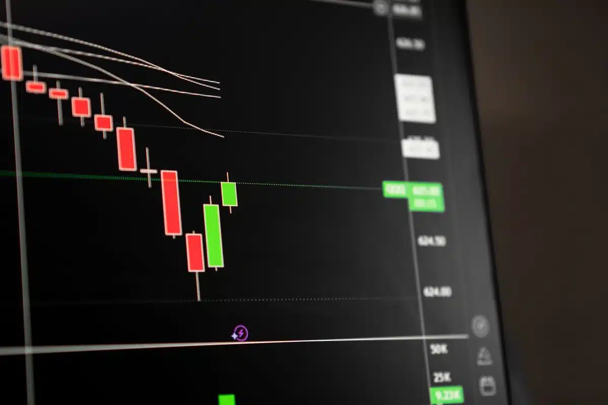 Stock market ticker board glowing with green numbers, candlestick chart climbing upward, abstract financial data streams in soft focus, optimistic market sentiment