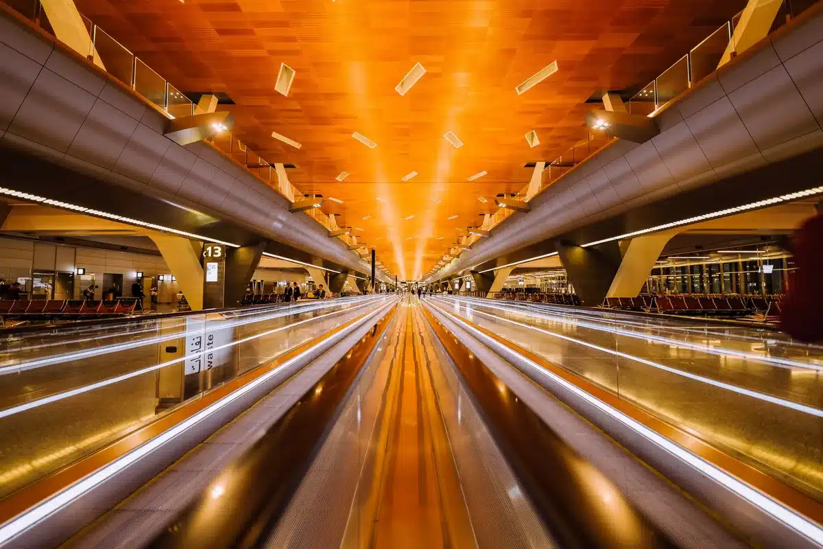 Chicago O'Hare airport terminal interior with United Airlines signage visible, aircraft boarding areas, modern architectural design, bustling with travelers and operations