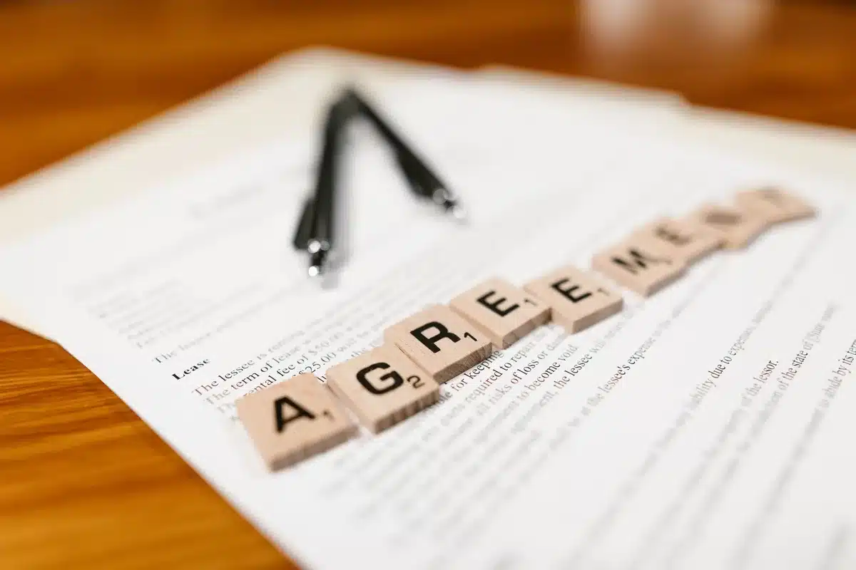 A contract document on a desk with a pen positioned beside it, representing the upcoming extension negotiations