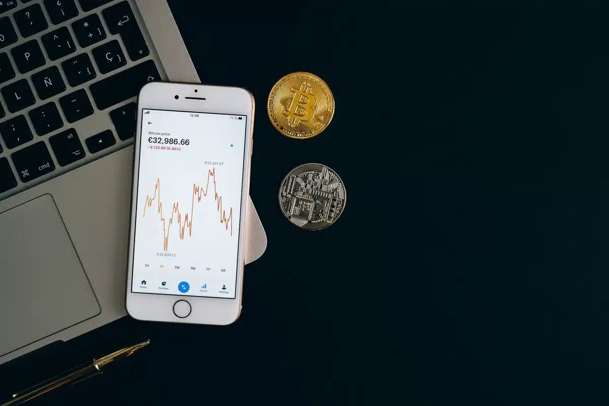 A close-up of a digital wallet interface on a smartphone screen displaying a stablecoin balance in USD, the glow of the display reflecting off a polished surface, soft blue and white tones suggesting financial technology and digital currency