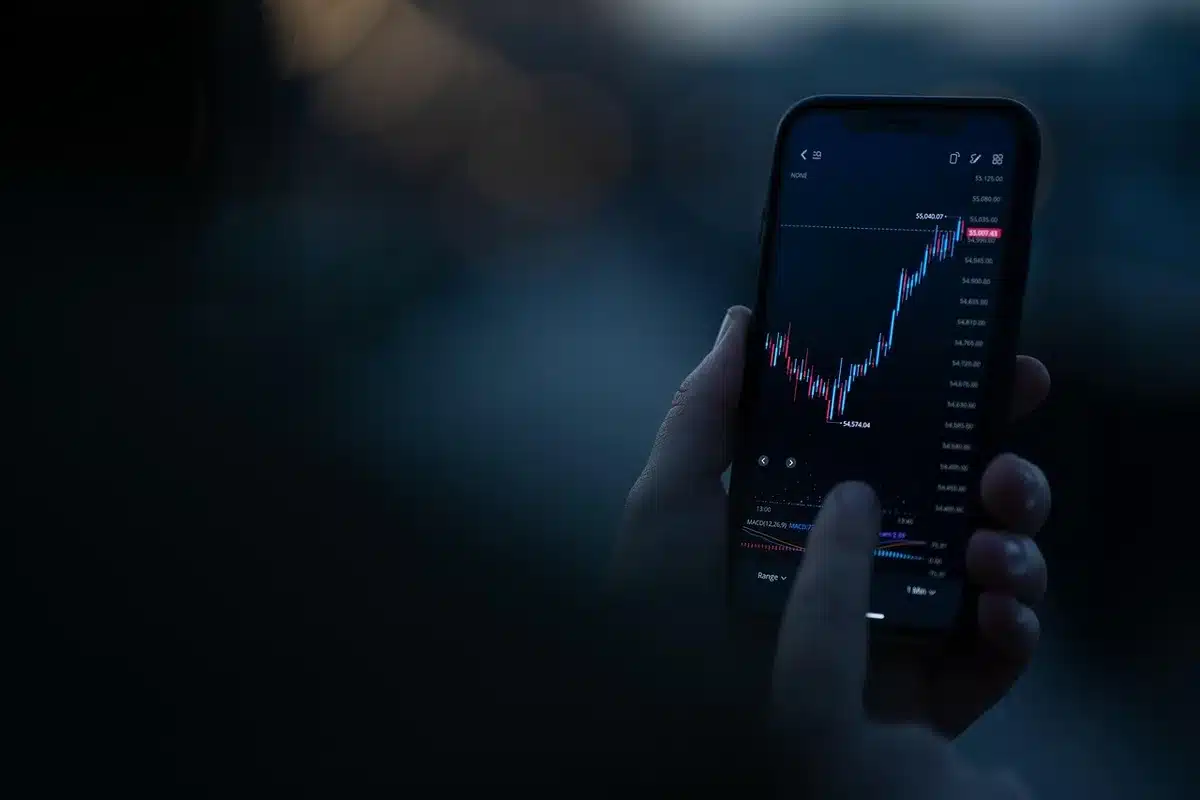 A glowing oil price ticker displaying numbers climbing past the $100 mark, red digits on a dark screen with upward arrows, market data streaming