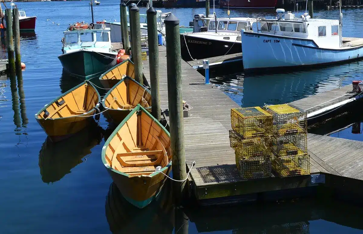 Lobster fishing boats in harbor, working waterfronts, fishermen on deck, maritime heritage scene