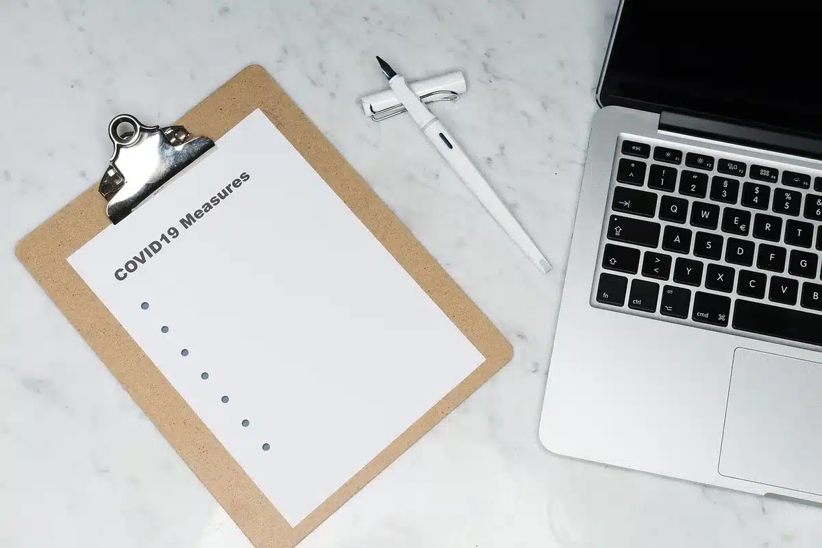 Close-up of a lined notebook open to a bulleted list titled 'conversation tools' (no brand), a pen lying across the page, warm indoor light &mdash; planning and tactics vibe