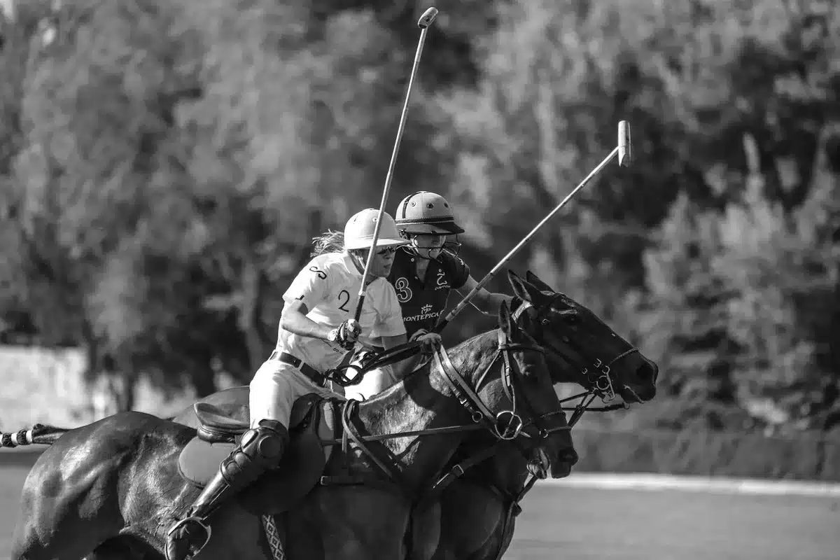 A princess in formal attire on a polo field podium, hands extended toward a slipping trophy, teammates beside her, a moment of genuine reaction breaking through royal composure, afternoon sunlight catching the scene