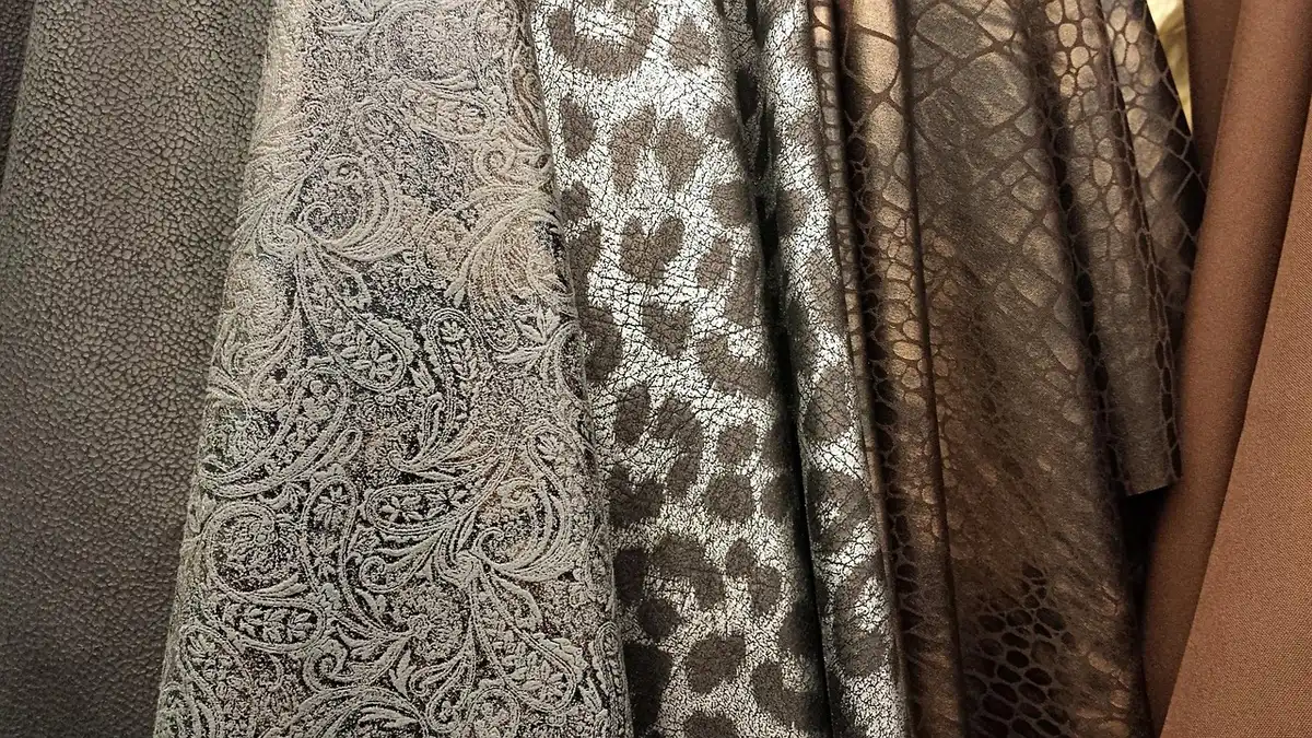 Luxury cotton fabric texture close-up, fine weave detail, premium material swatch with soft lighting