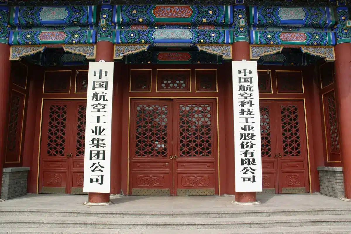 A closed ceremonial door of a stately residence, no signage, late afternoon light on stone steps