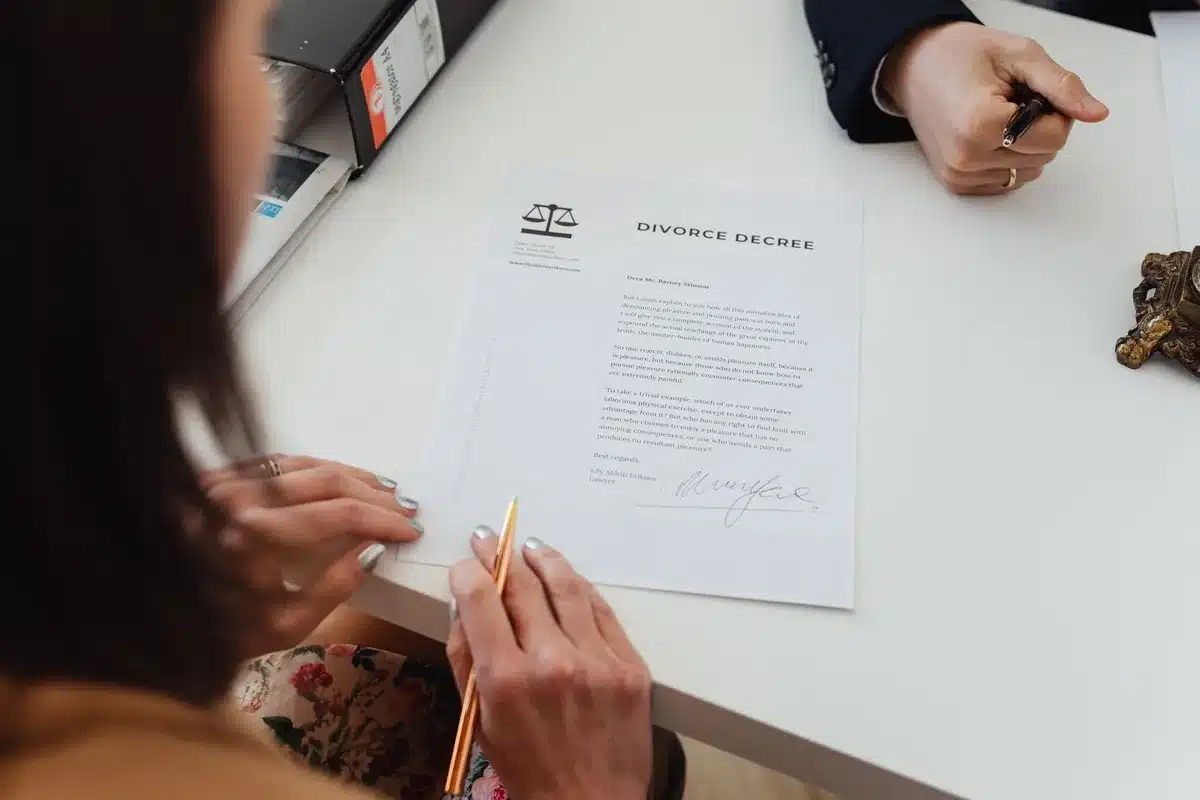 empty congressional office desk with an anonymous stack of paper documents, a turned-off smartphone, and a legal pad with a pen — atmosphere of formal complaint, no identifiable people