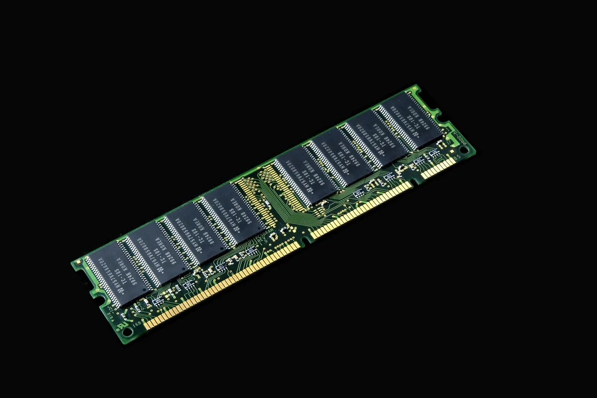 close-up of unbranded circuit-board modules laid out on a table, technician gloves nearby, shallow depth of field