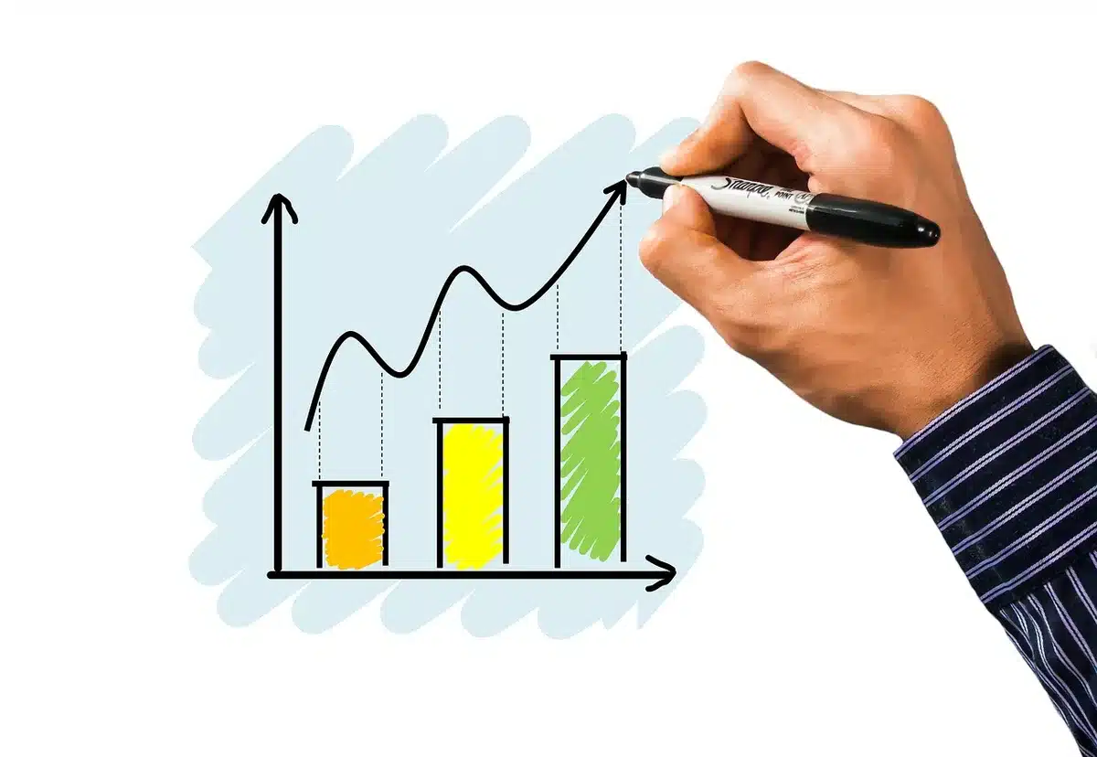 A financial analyst reviewing risk assessment charts on a computer screen, with stress test scenarios and market volatility graphs visible, illustrating portfolio diversification strategy.