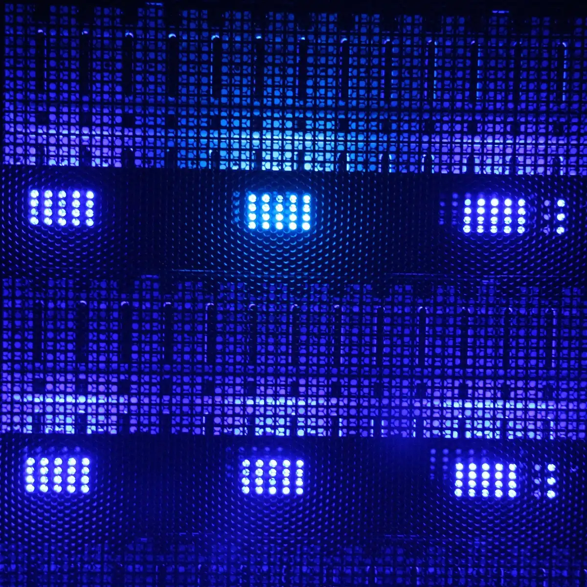 A glowing server rack with abstract blue-green data streams flowing across dark surfaces, representing the digital infrastructure of an AI platform