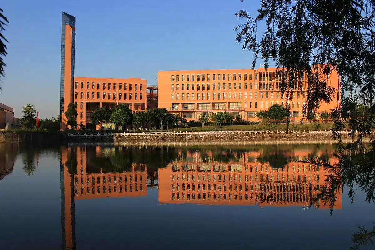 An exterior shot of a modern data centre campus at dusk, anonymous server buildings and service roads under streetlights, no logos or signage, conveying scale and infrastructure