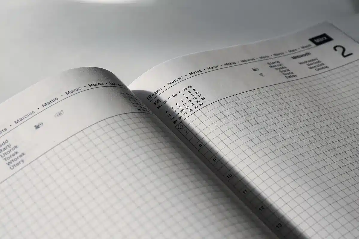 A retirement-focused scene showing a calendar marking October 14, surrounded by financial documents and benefit statements, evoking the anticipation of the official announcement date.