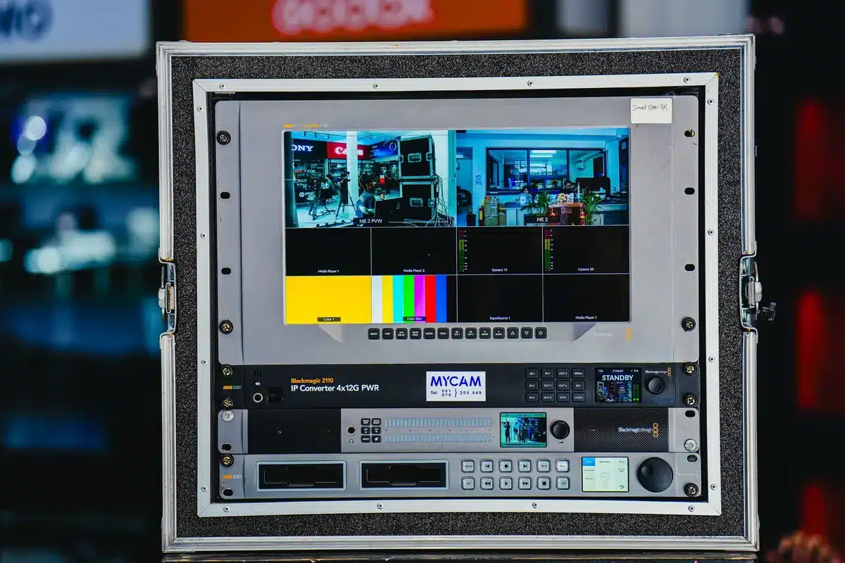 Empty living room with a large TV turned off, a streaming remote on the coffee table and an unplugged coax cable draped over an armchair — a quiet sign of cord-cutting