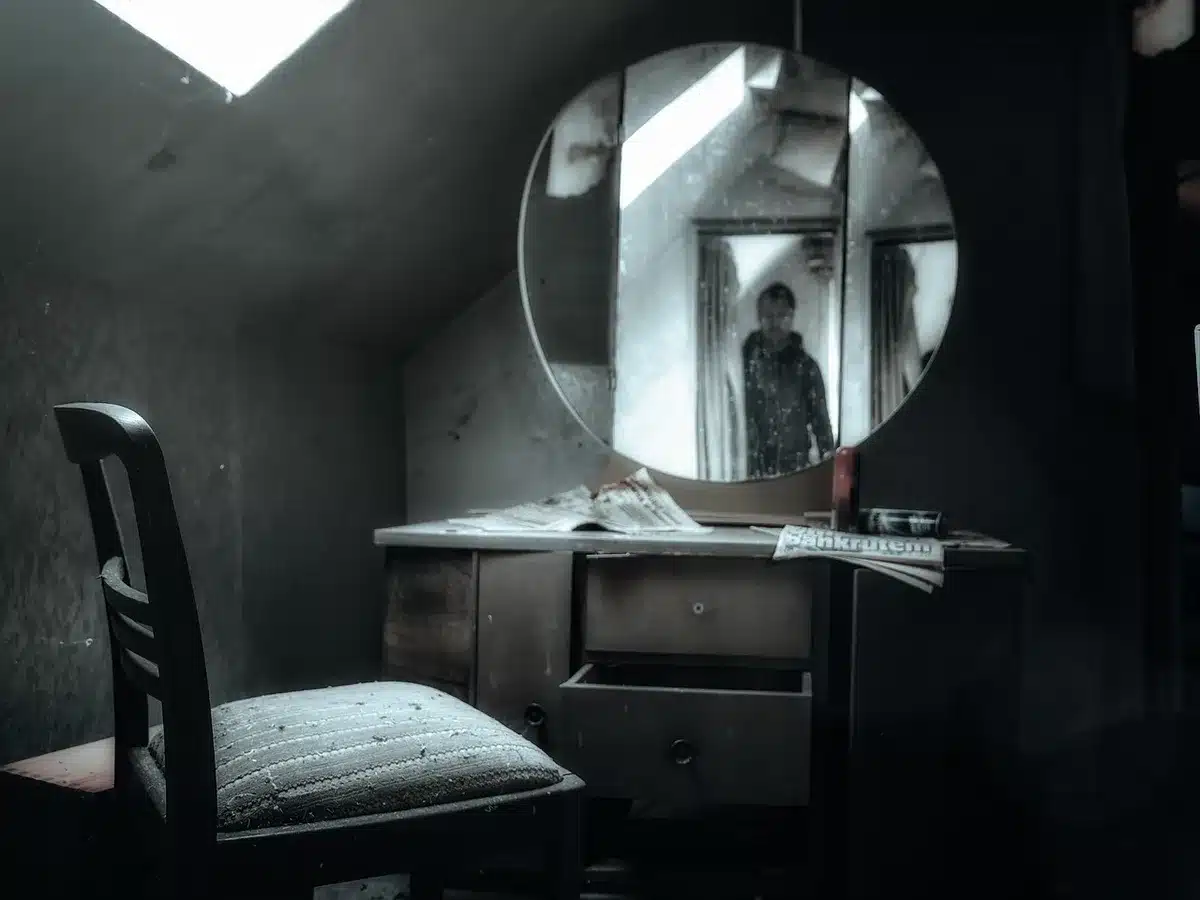 Close-up of a worn captain's chair on a dimly lit set, no insignia, a folded script on the seat suggesting a long career